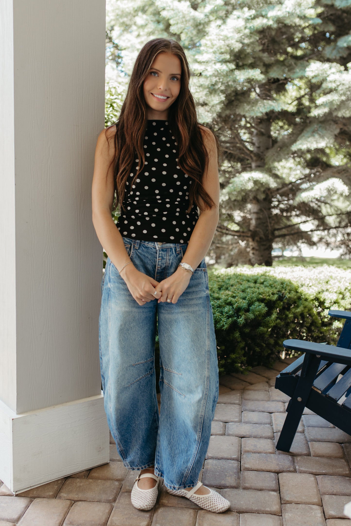 THE AINARA POLKA DOT SLEEVELESS KNIT TOP IN BLACK