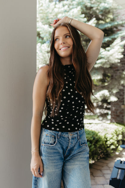 THE AINARA POLKA DOT SLEEVELESS KNIT TOP IN BLACK