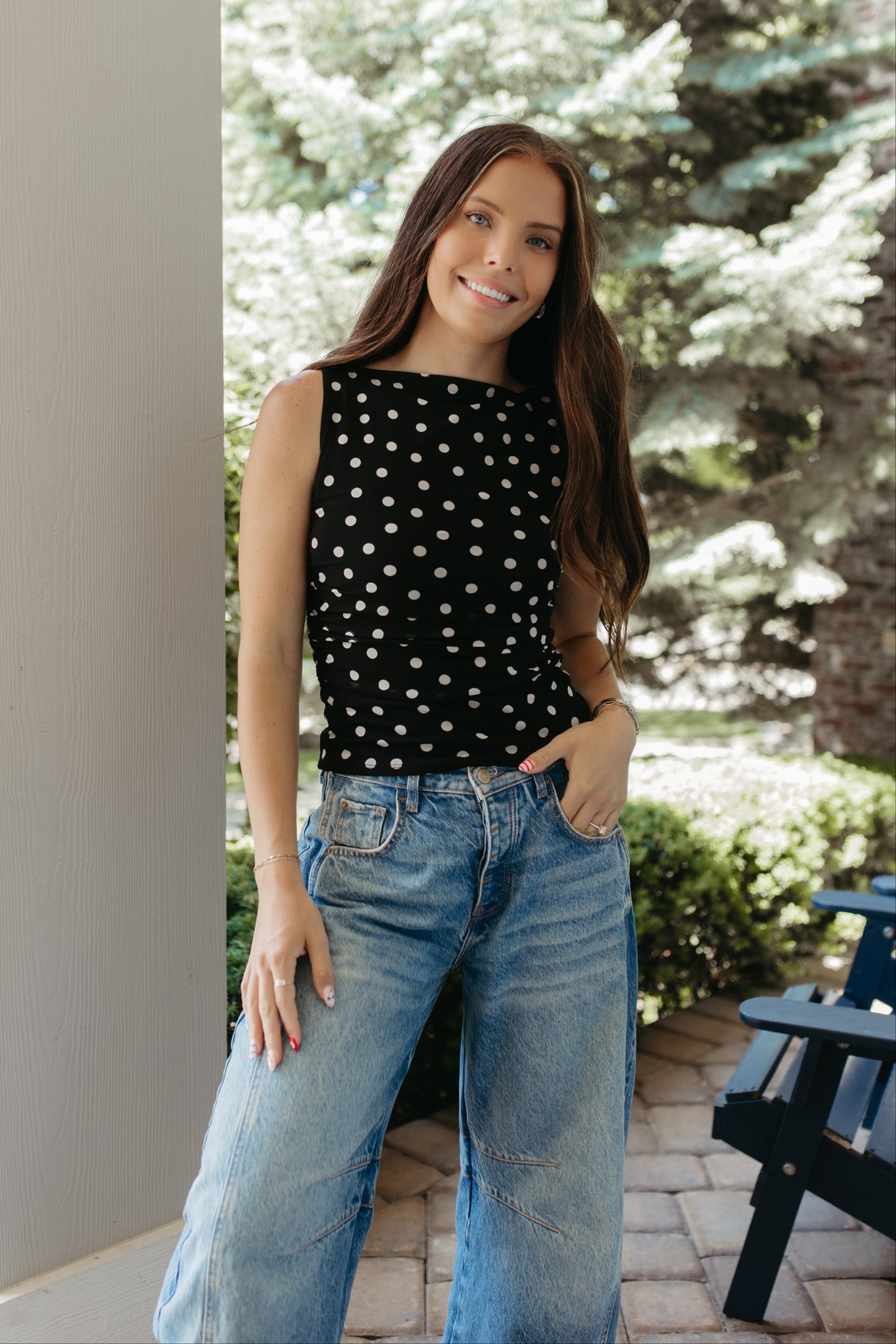 THE AINARA POLKA DOT SLEEVELESS KNIT TOP IN BLACK