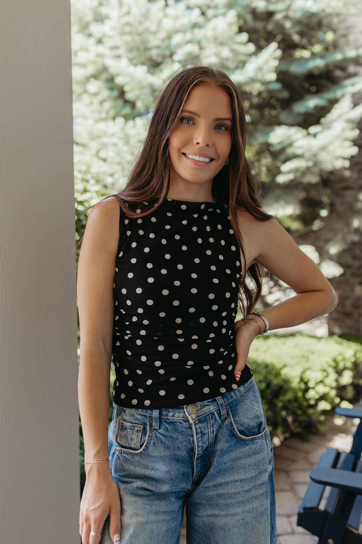 THE AINARA POLKA DOT SLEEVELESS KNIT TOP IN BLACK