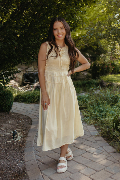 THE ROBIN FRONT TIE SMOCKED DRESS IN YELLOW