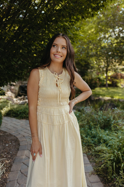 THE ROBIN FRONT TIE SMOCKED DRESS IN YELLOW