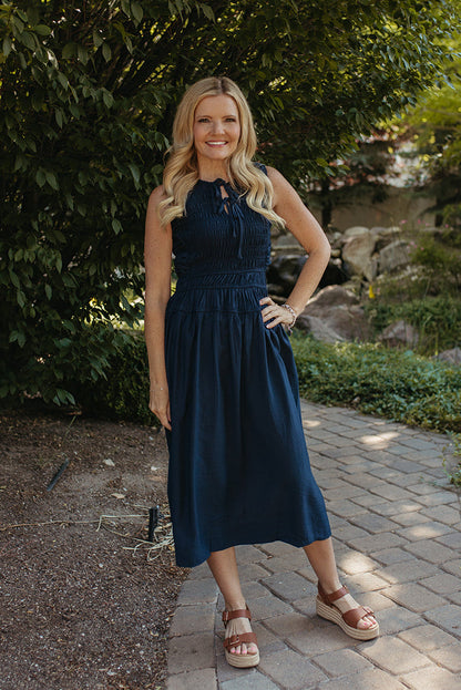 THE ROBIN FRONT TIE SMOCKED DRESS IN NAVY