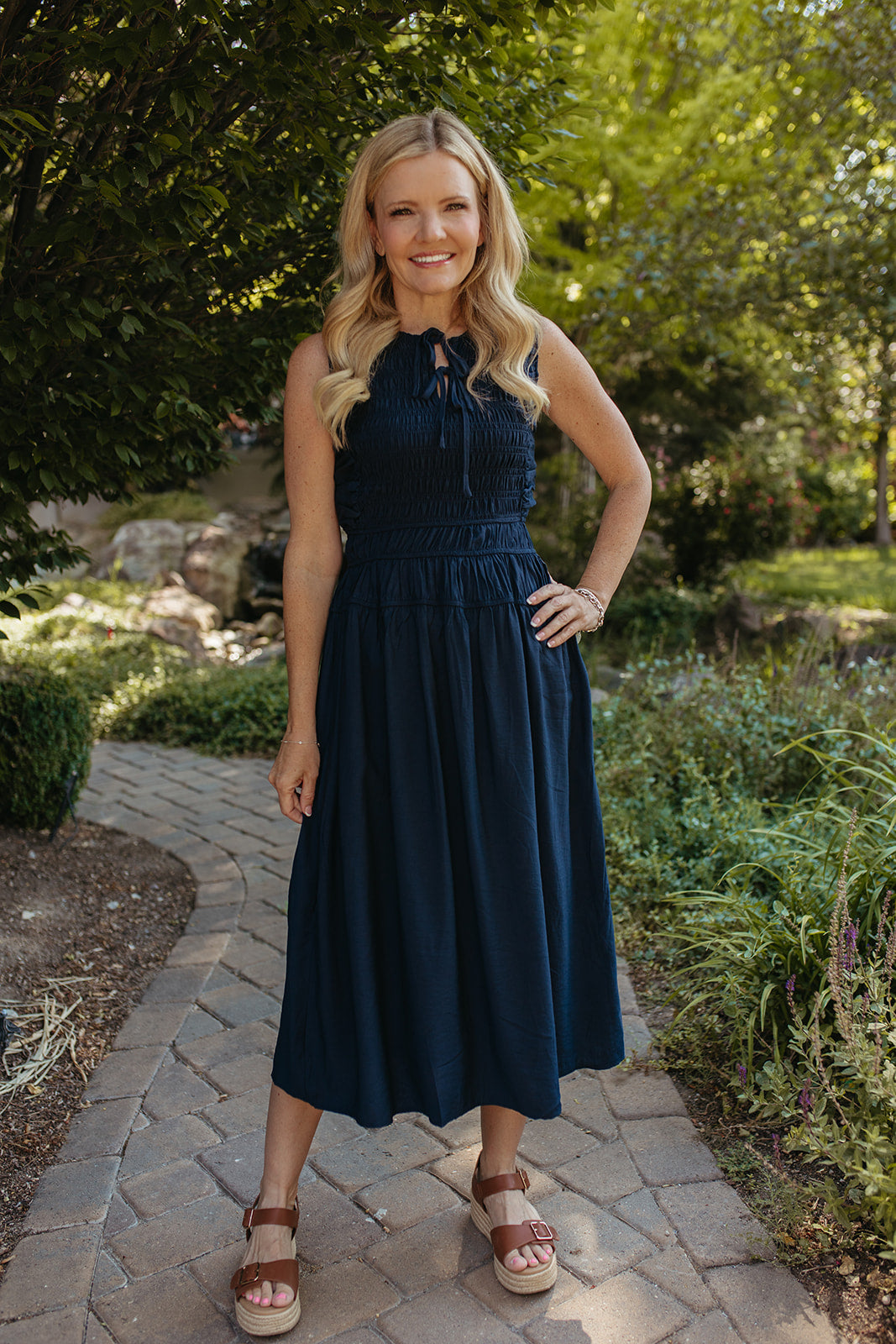 THE ROBIN FRONT TIE SMOCKED DRESS IN NAVY