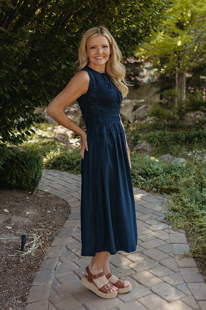 THE ROBIN FRONT TIE SMOCKED DRESS IN NAVY