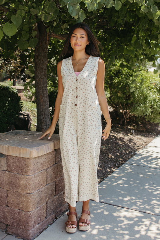 THE AYLA FLORAL V-NECK BUTTON JUMPSUIT IN CREAM