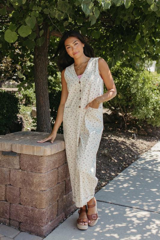 THE AYLA FLORAL V-NECK BUTTON JUMPSUIT IN CREAM