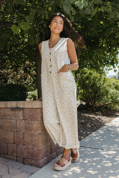 THE AYLA FLORAL V-NECK BUTTON JUMPSUIT IN CREAM