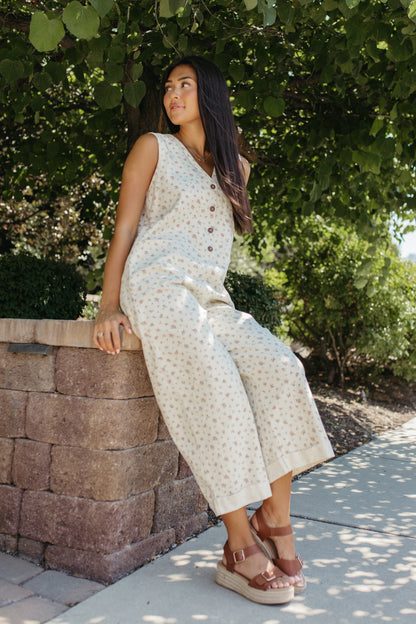 THE AYLA FLORAL V-NECK BUTTON JUMPSUIT IN CREAM