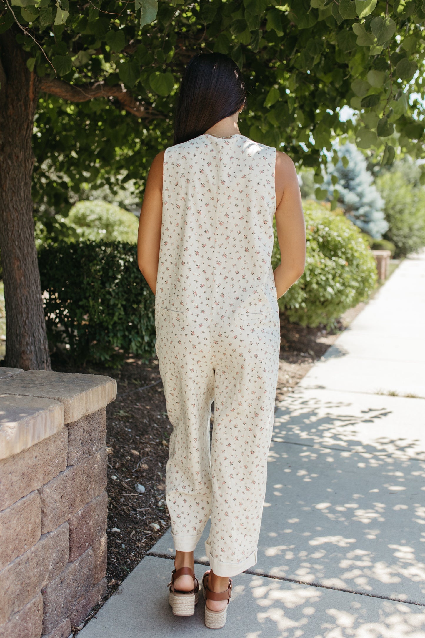 THE AYLA FLORAL V-NECK BUTTON JUMPSUIT IN CREAM