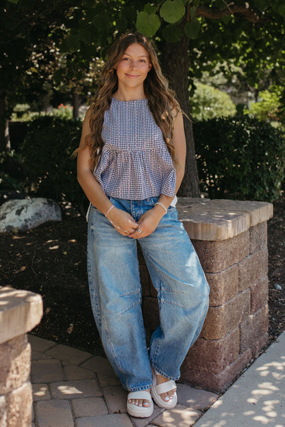 THE EVIE SKY MEADOW PEPLUM TOP IN NAVY
