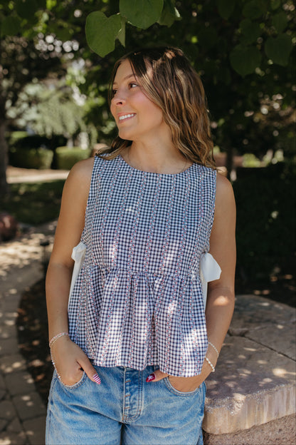 THE EVIE SKY MEADOW PEPLUM TOP IN NAVY