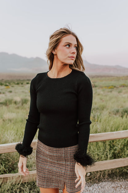 THE FEATHER CUFF LONG SLEEVE TOP IN BLACK