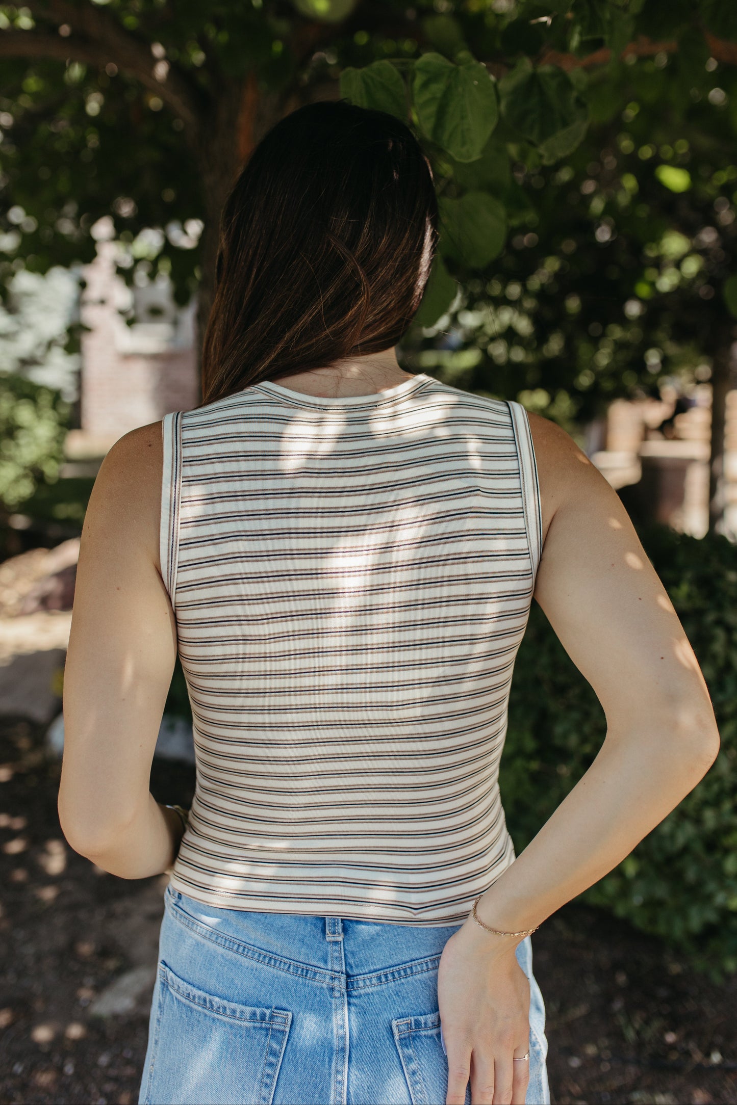 THE GUINEVERE STRIPED SLEEVELESS BUTTON TANK IN IVORY