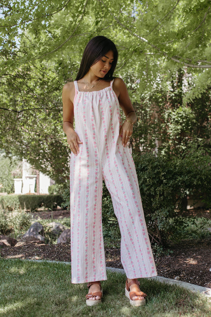 THE SERENITY STRIPE JUMPSUIT IN IVORY