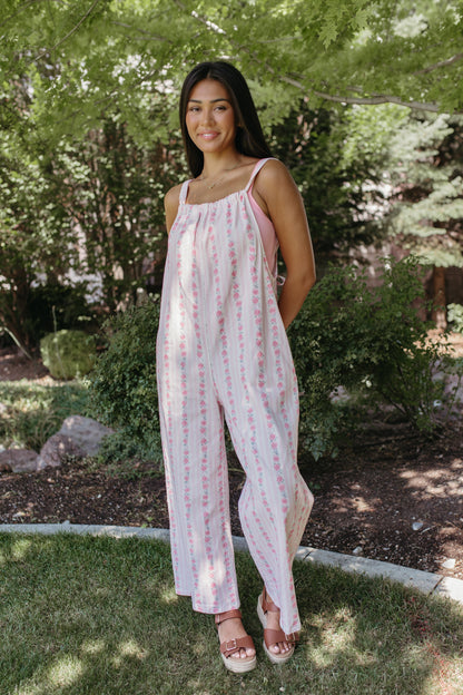 THE SERENITY STRIPE JUMPSUIT IN IVORY