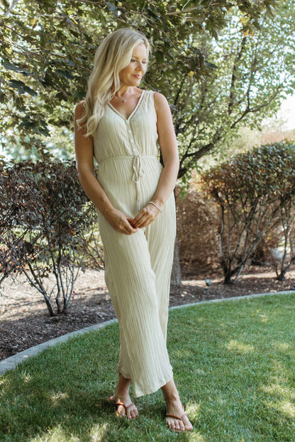 THE OLIVIA SLEEVELESS JUMPSUIT IN BEIGE
