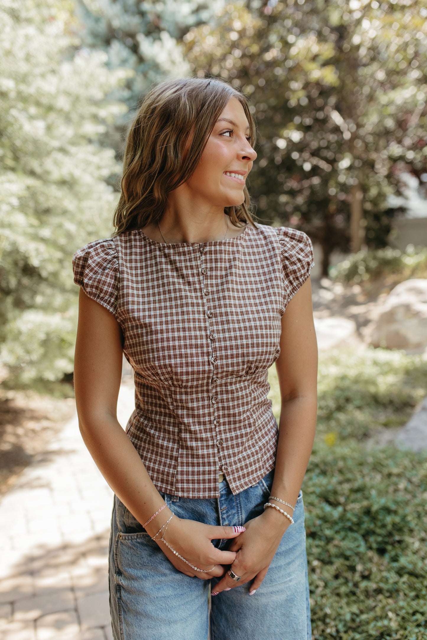 THE COLBIE PLAID PUFF SLEEVE BUTTON TOP IN DARK BROWN