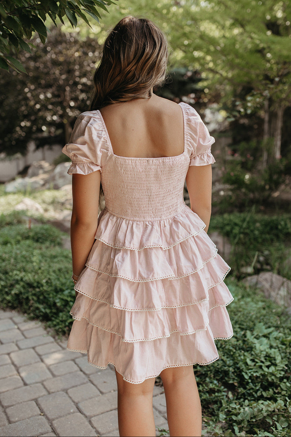 THE DULCE TIERED SMOCKED RUFFLE DRESS IN PINK