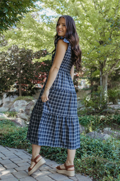 THE LEILANI PLAID TIERED SMOCKED DRESS IN NAVY