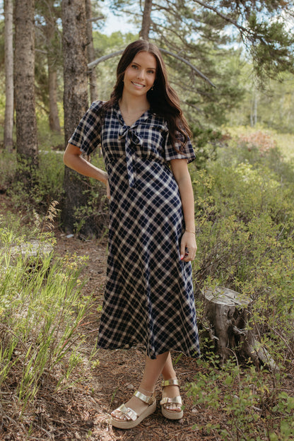 THE IVY PLAID MIDI V-NECK DRESS IN NAVY