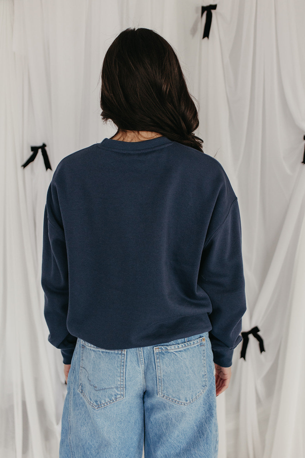 THE MILEY BOW EMBROIDERED SWEATSHIRT IN INDIGO