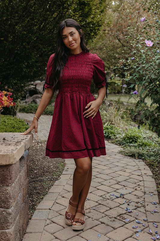 The Lyanna Gingham Smocked Dress in Dark Red, photo 1 of 4