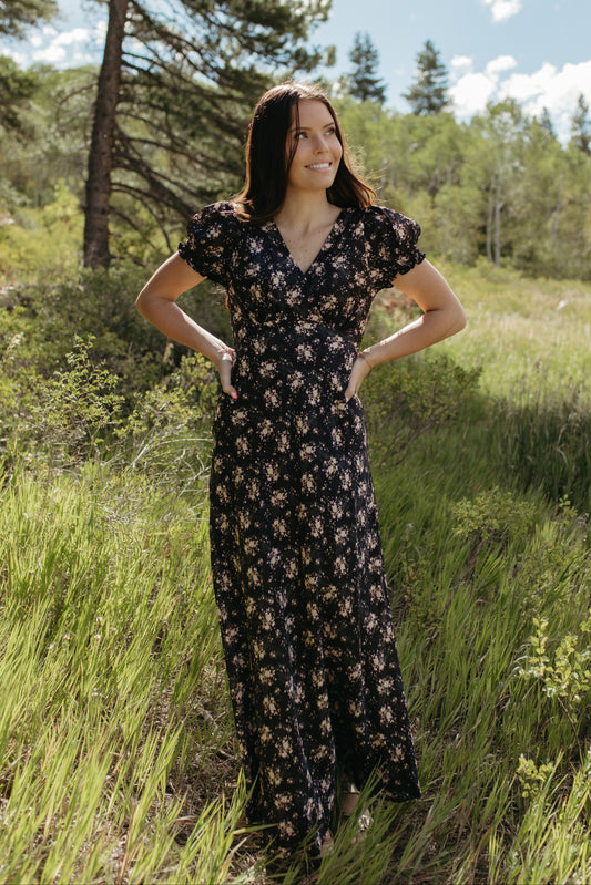 THE CELINE FLORAL MAXI V-NECK DRESS IN BLACK