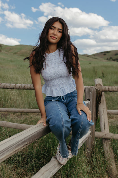 THE STORY SMOCKED PEPLUM TOP IN BLUE