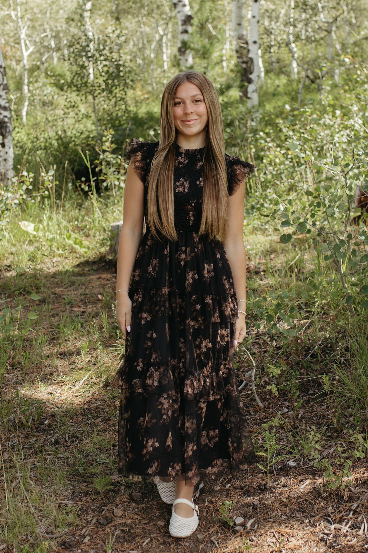 THE ADDISON FLORAL TIERED SMOCKED DRESS IN BLACK