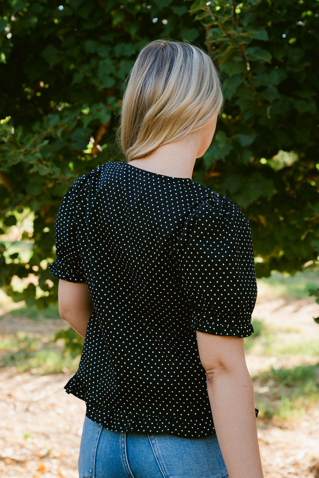 THE KRISTIE POLKA DOT BLOUSE IN BLACK