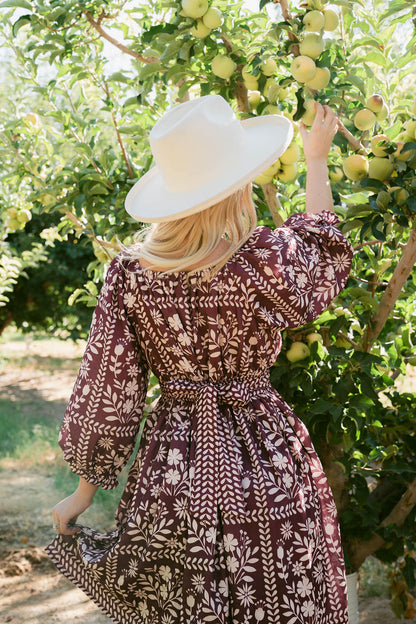 THE ROXANNE FLORAL PRINT DRESS IN PLUM