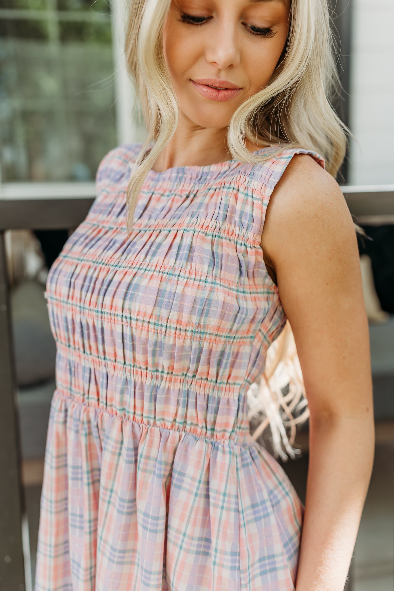 THE SAVANNAH SMOCKED PLAID DRESS IN CORAL