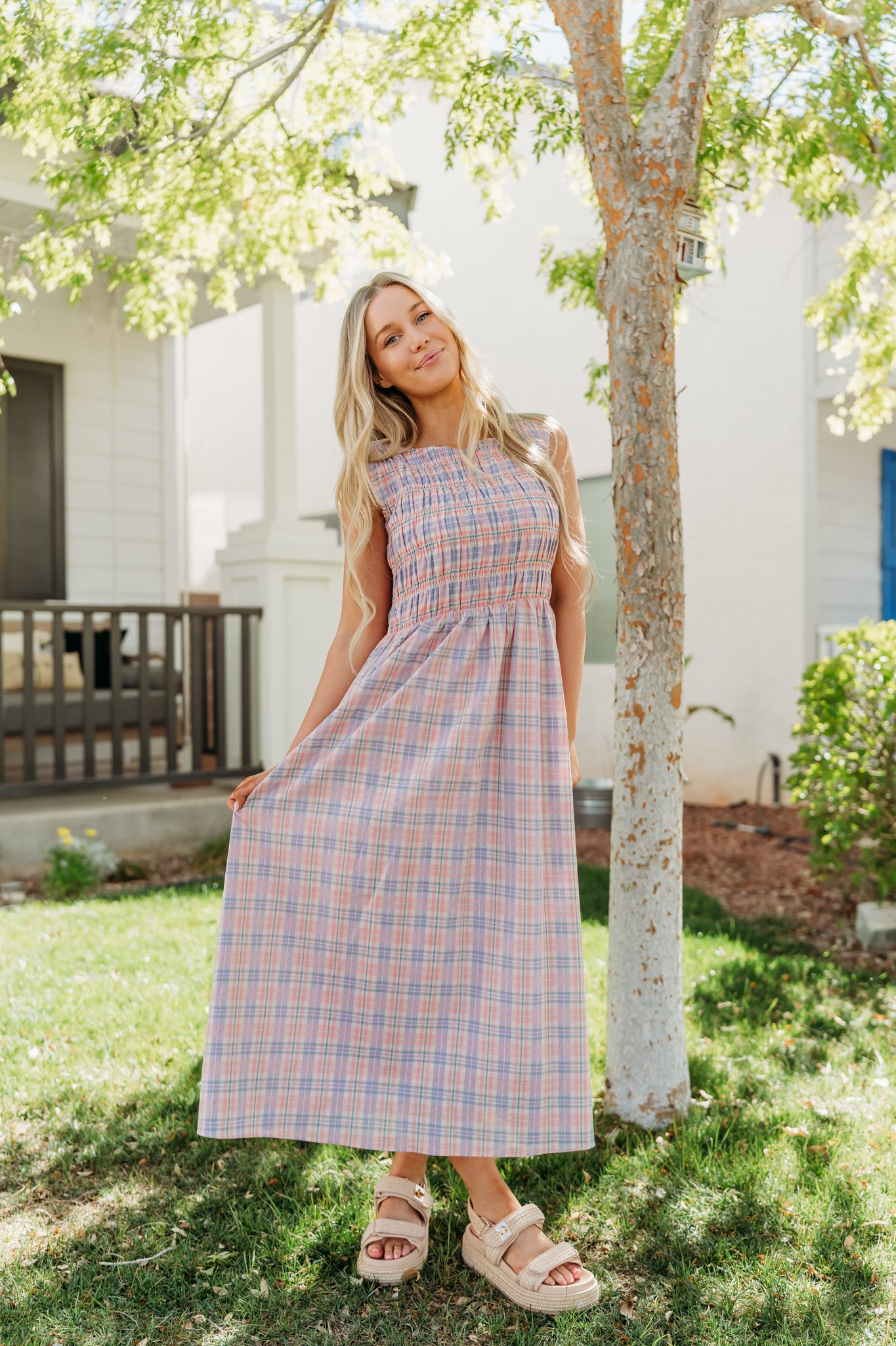 THE SAVANNAH SMOCKED PLAID DRESS IN CORAL