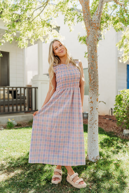 THE SAVANNAH SMOCKED PLAID DRESS IN CORAL