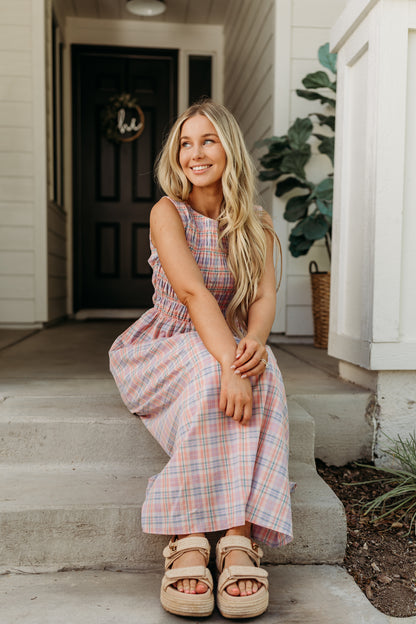 THE SAVANNAH SMOCKED PLAID DRESS IN CORAL