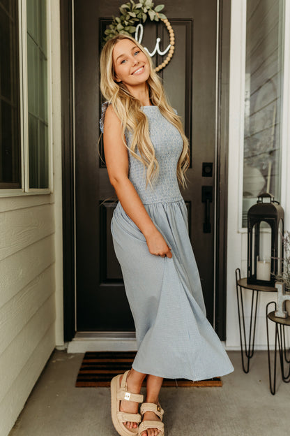 THE BLAIRE SMOCKED GINGHAM MIDI DRESS IN LIGHT BLUE