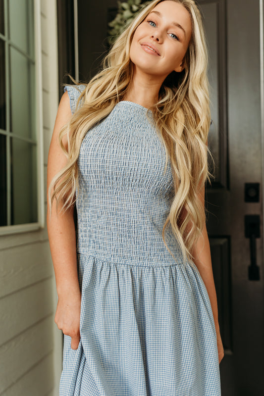 THE BLAIRE SMOCKED GINGHAM MIDI DRESS IN LIGHT BLUE
