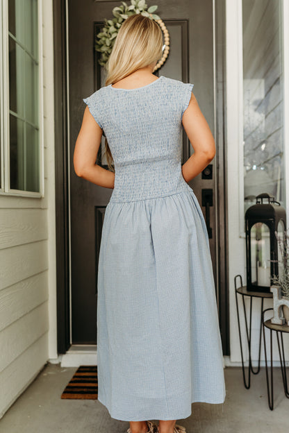 THE BLAIRE SMOCKED GINGHAM MIDI DRESS IN LIGHT BLUE