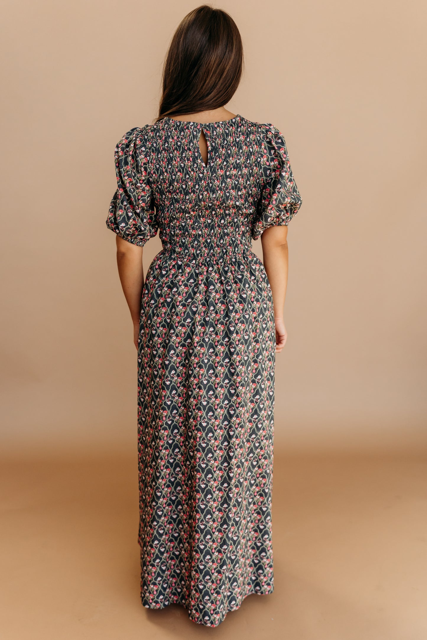THE MAXINE SMOCKED FLORAL MAXI IN BLACK