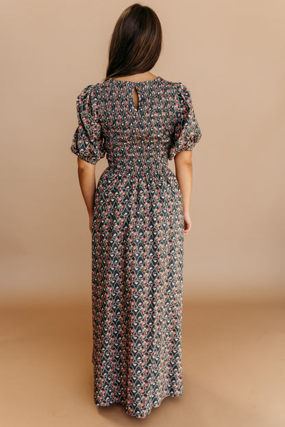 THE MAXINE SMOCKED FLORAL MAXI IN BLACK