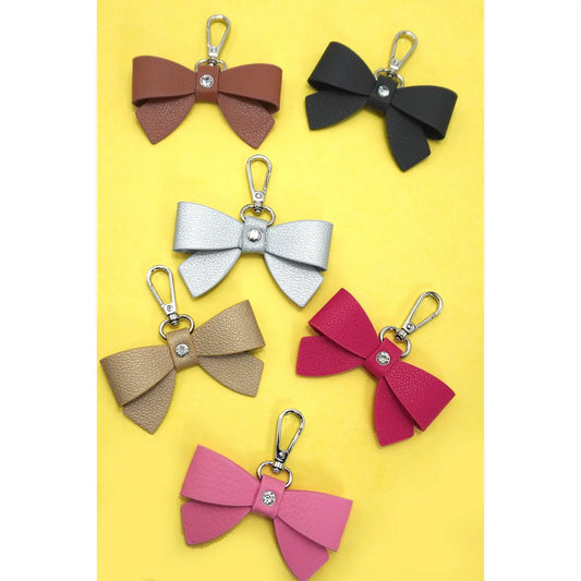 THE MIDNIGHT BOW BAG CHARM IN BLACK