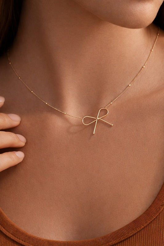 THE GOLDEN BOW TIED NECKLACE
