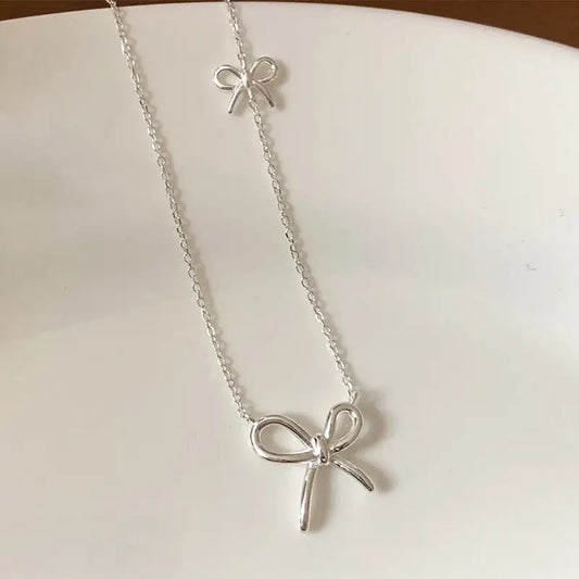 THE SILVER BOW LAYERED NECKLACE
