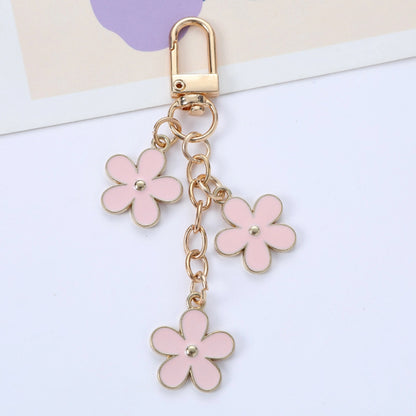 THE TRIPLE FLOWER BAG CHARM