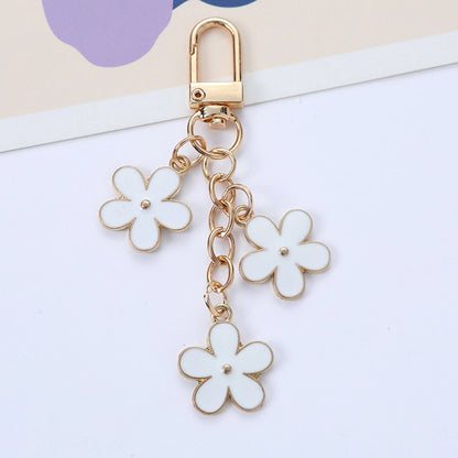 THE TRIPLE FLOWER BAG CHARM