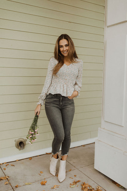 THE FLIRTY FLORAL PEPLUM TOP IN IVORY