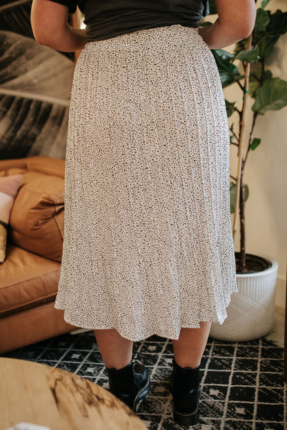 THE SHEANA SPOTTED PLEATED SKIRT IN IVORY