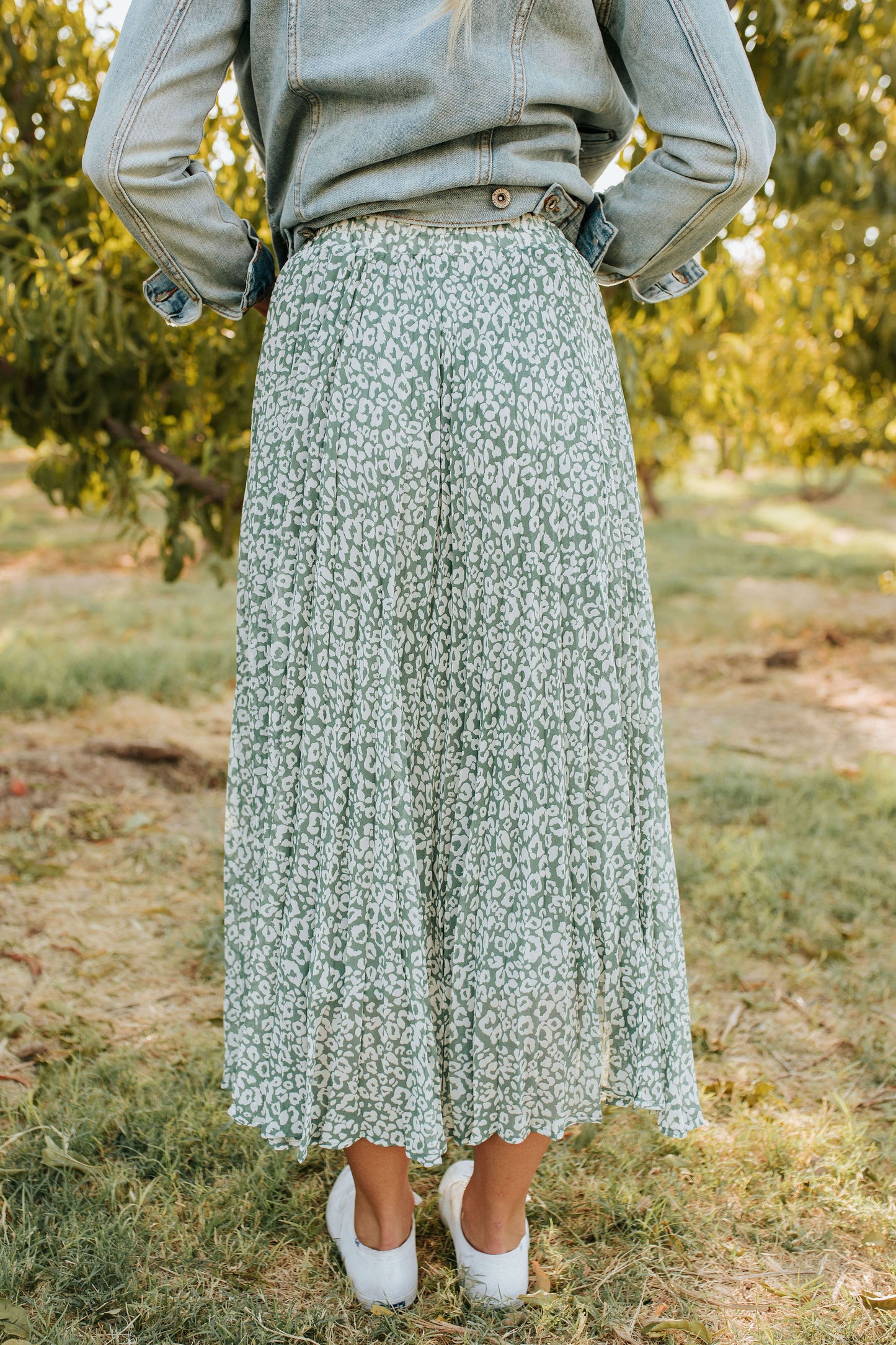 THE LILA LEOPARD PLEATED MIDI SKIRT IN DUSTY SAGE