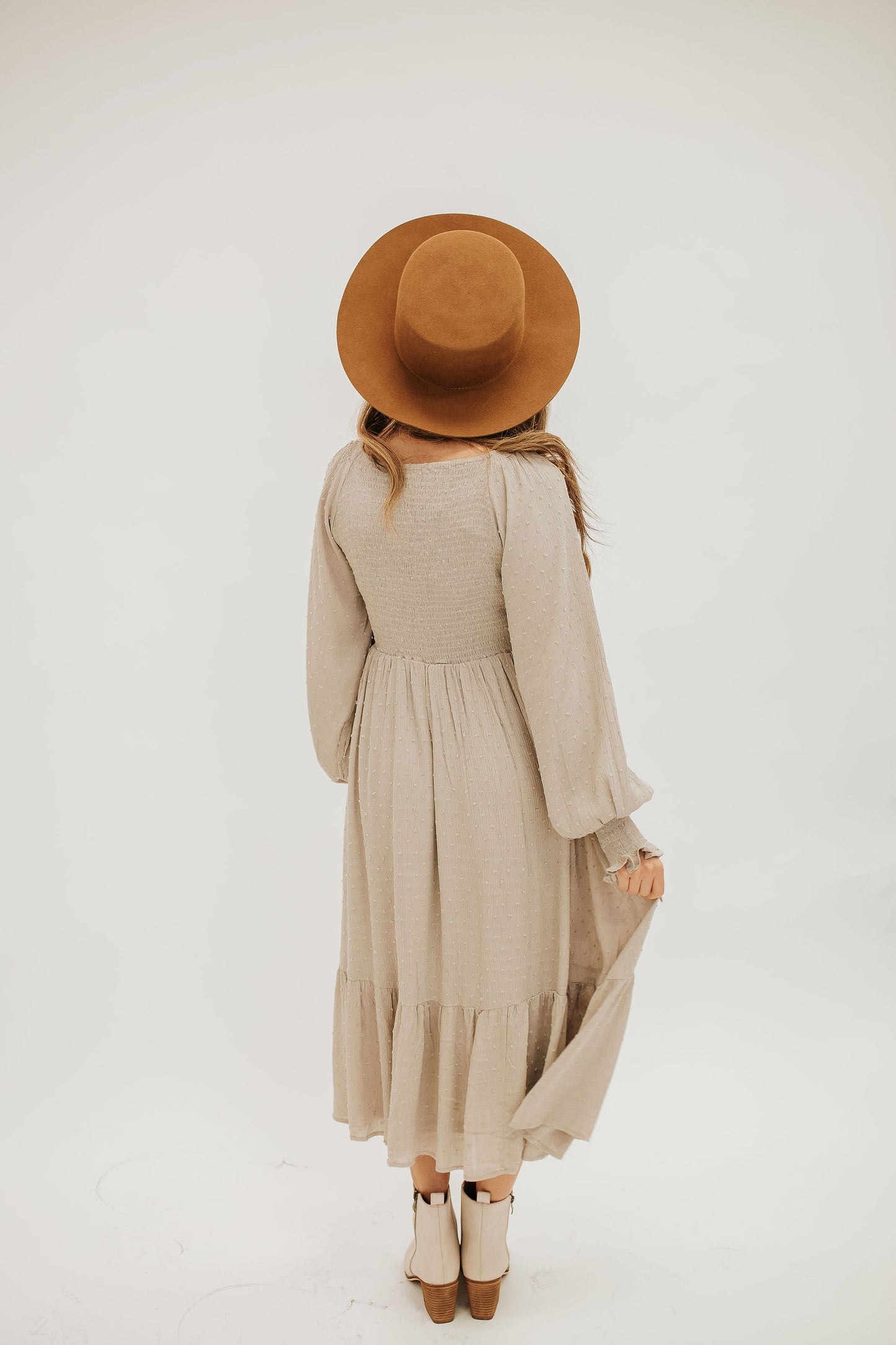 THE SCOUT SMOCKED SWISS DOT MIDI DRESS IN SAND